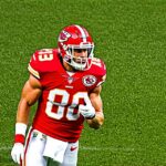 Why does Travis Kelce choose the number 87 for his jersey?